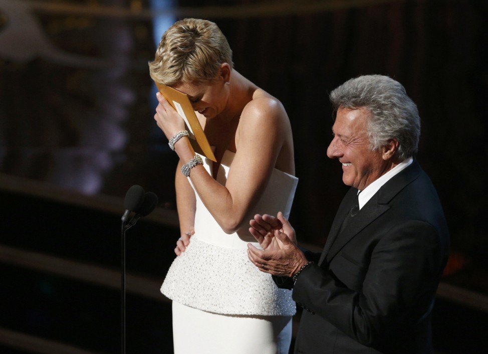 Charlize Theron and Dustin Hoffman present an award at the 85th Academy Awards in Hollywood