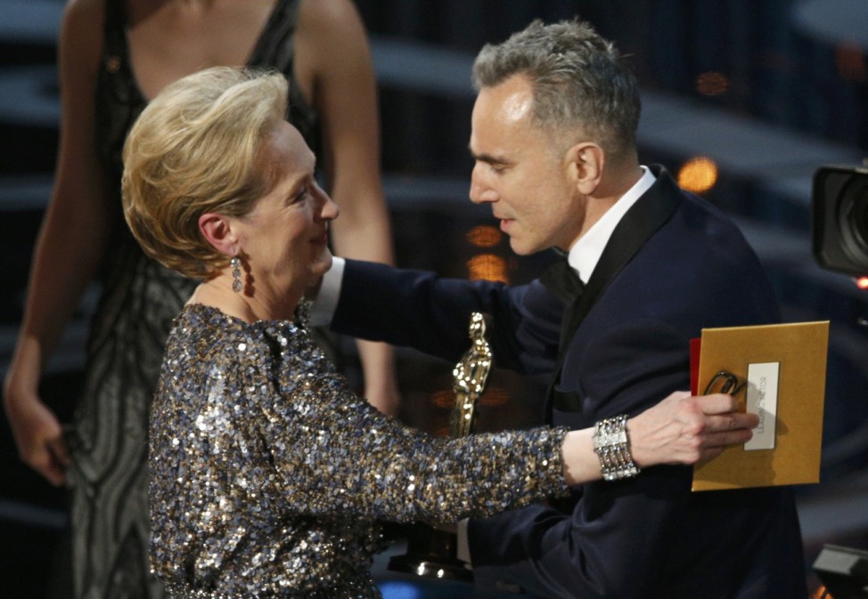 Actress Meryl Streep presents the Oscar for best actor to Daniel Day Lewis for his role in 'Lincoln' at the 85th Academy Awards in Hollywood