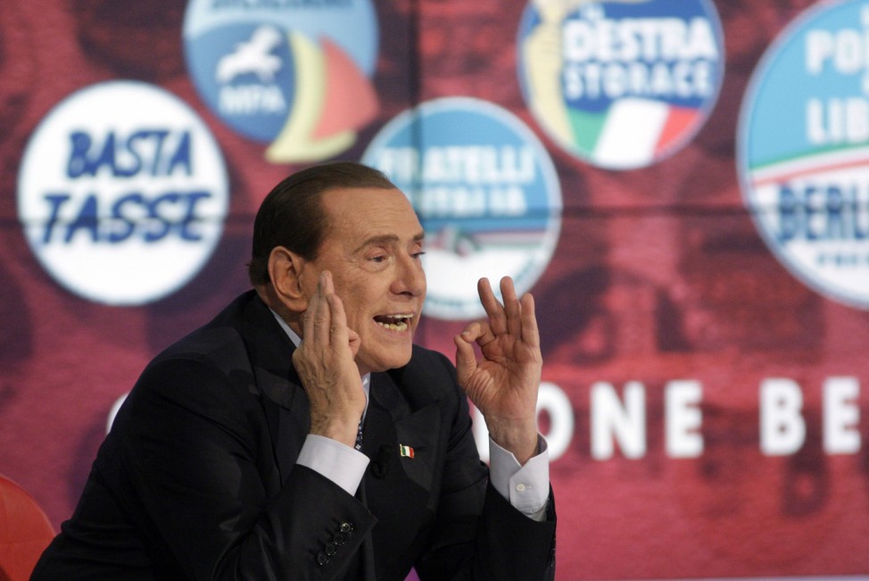 Italy's former Prime Minister Silvio Berlusconi gestures as he appears as a guest on the RAI television show Porta a Porta (Door to Door) in Rome