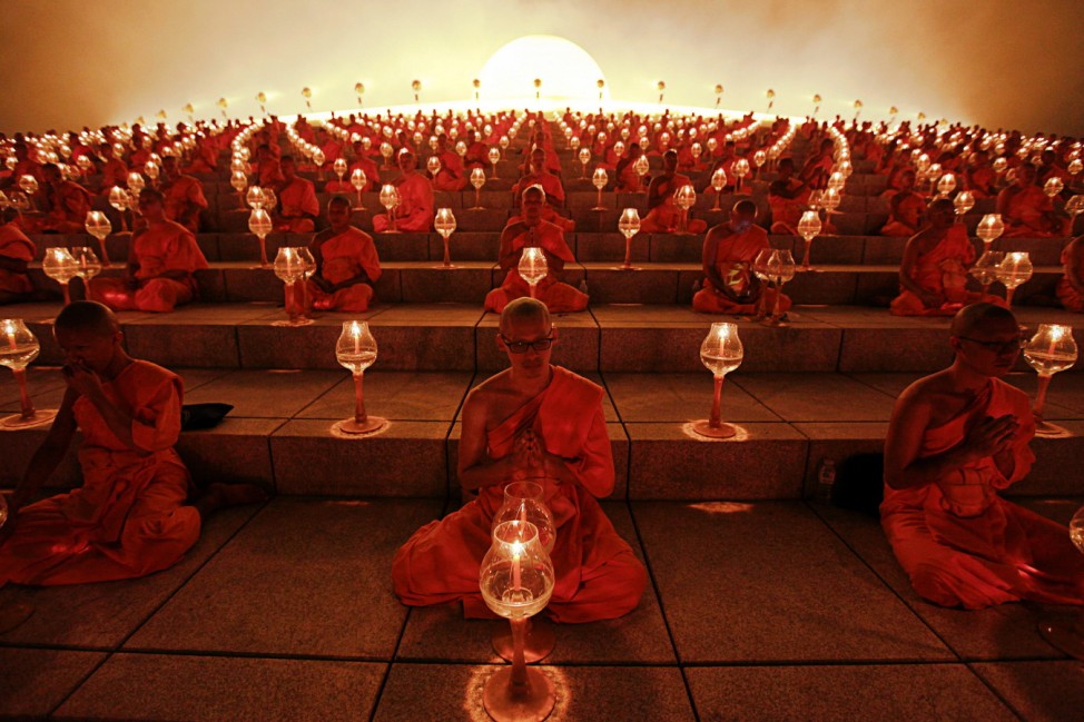 Buddhist monks pray at the Wat Phra Dhammakaya temple in Pathum Thani province, north of Bangkok on Makha Bucha Day