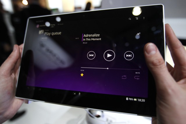A visitor holds the new Sony Xperia Z Tablet during the Mobile World Congress in Barcelona