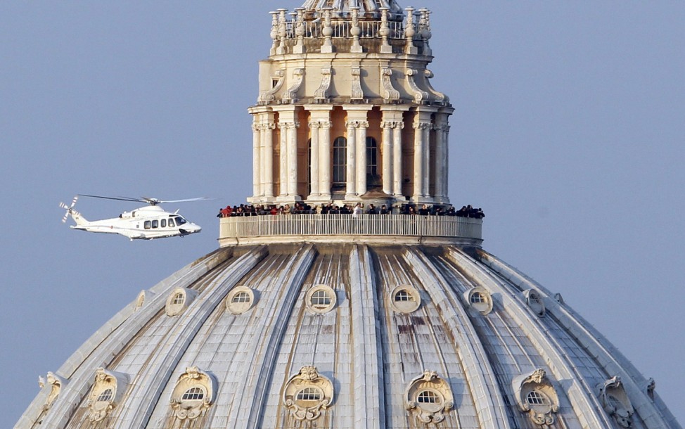 A helicopter carrying Pope Benedict XVI takes off from inside the Vatican on its way to the papal summer residence at Castelgandolfo