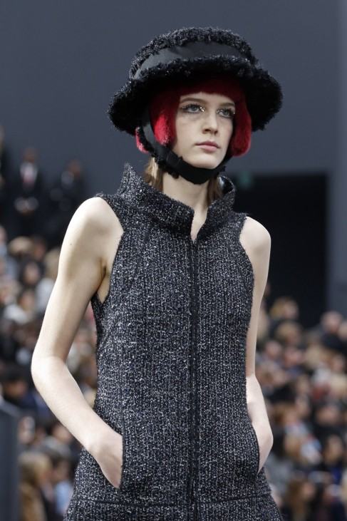 A model presents a creation by German designer Lagerfeld for French fashion house Chanel as part of his Fall-Winter 2013/2014 women's ready-to-wear fashion show during Paris fashion week