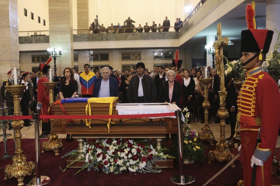 Handout of Argentina's President Fernandez, her Uruguayan counterpart Mujica and her Bolivian counterpart Morales stand next to the coffin of late Venezuelan President Chavez during a wake at the military academy in Caracas