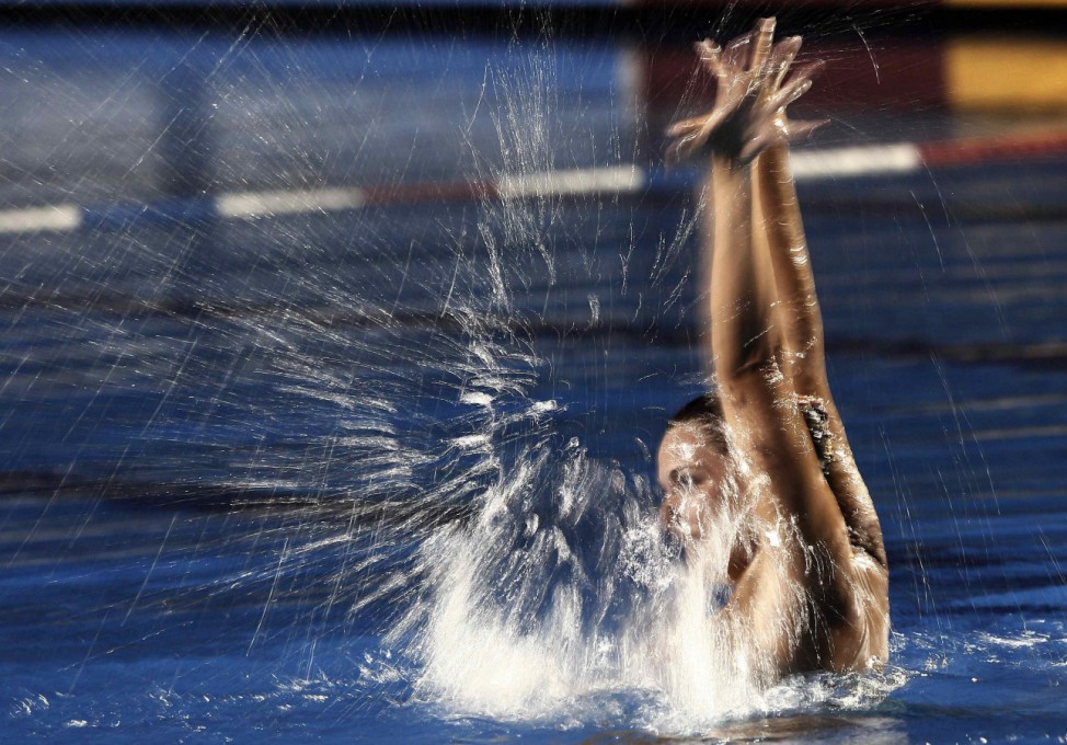 Costa Rica's Mitinan  performs in the women's synchronized swimming solo free routine final at the Central American Games in San Jose