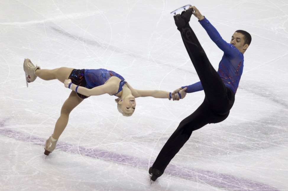Savchenko and Szolkowy of Germany perform their pairs short program at the ISU World Figure Skating Championships in London