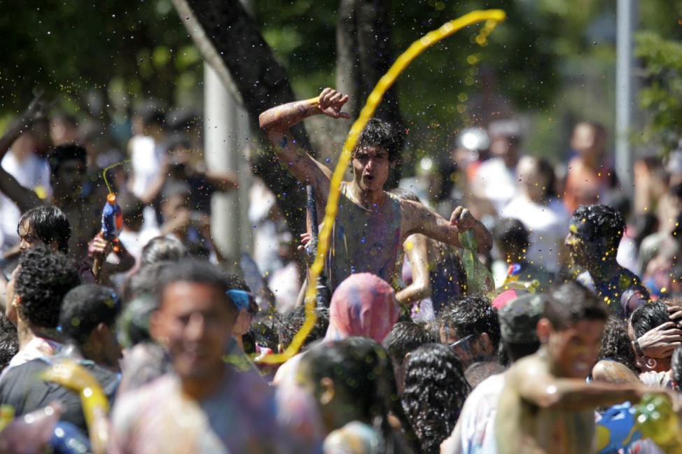 A man reacts during a 'paint war' flash mob in the city park in Brasilia