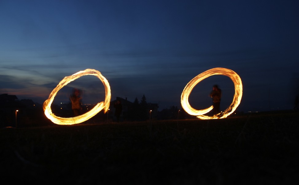 Children spin rings of fire during rituals in celebration of Sirni Zagovezni, the first Sunday before Great Lent, in the village of Lozen