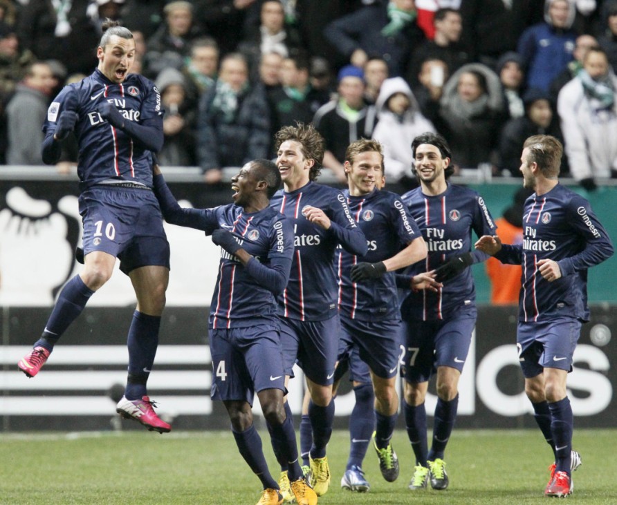 Zlatan Ibrahimovic of Paris St Germain celebrates with team mates after scoring against St Etienne during their French Ligue 1 soccer match at the Geoffroy Guichard stadium in Saint-Etienne