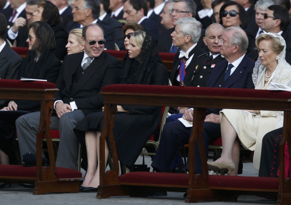 Monaco's Prince Albert and Princess Charlene sit with Belgium's King Albert and Queen Paola before the inaugural mass of Pope Francis at the Vatican