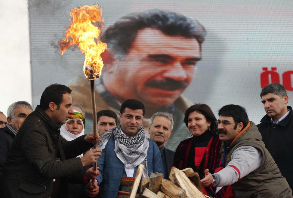 Demirtas, co-chairman of the pro-Kurdish Peace and Democracy Party, lights a traditional Newroz fire during a rally to celebrate the spring festival of Newroz in Istanbul