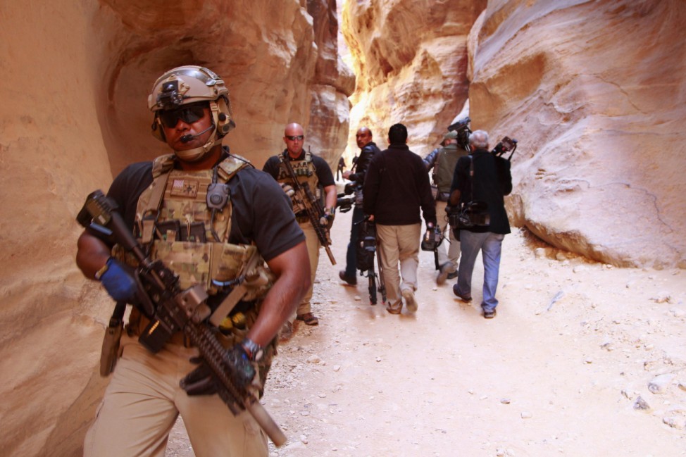 Members of the U.S. Secret Service Counter Assault Team survey area during Obama's tour of Petra