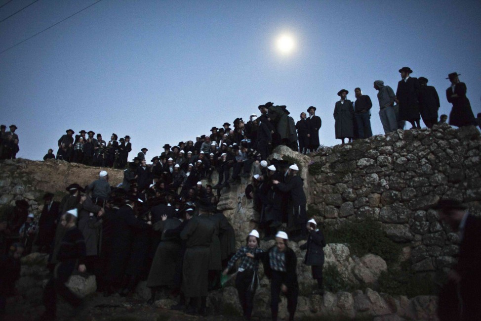 Ultra-Orthodox Jews take part in the 'Mayim Shelanu' ceremony to collect water from a natural spring, near Jerusalem