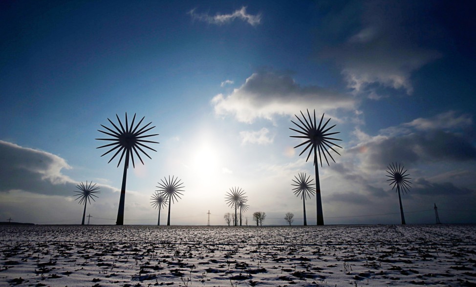 Wind turbines are pictured in this multiple exposure at the German village of Feldheim