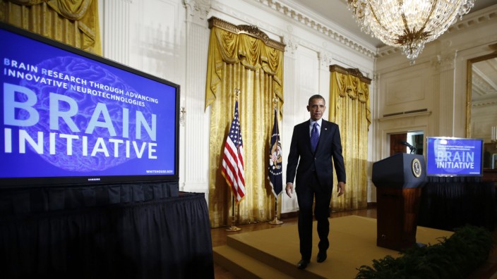 Obama walks off stage after announcing his administration's BRAIN initiative at the White House in Washington