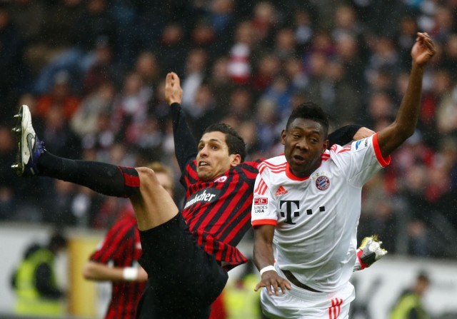Matmour of Eintracht Frankfurt challenges Alaba of Bayern Munich during their German first division Bundesliga soccer match in Frankfurt