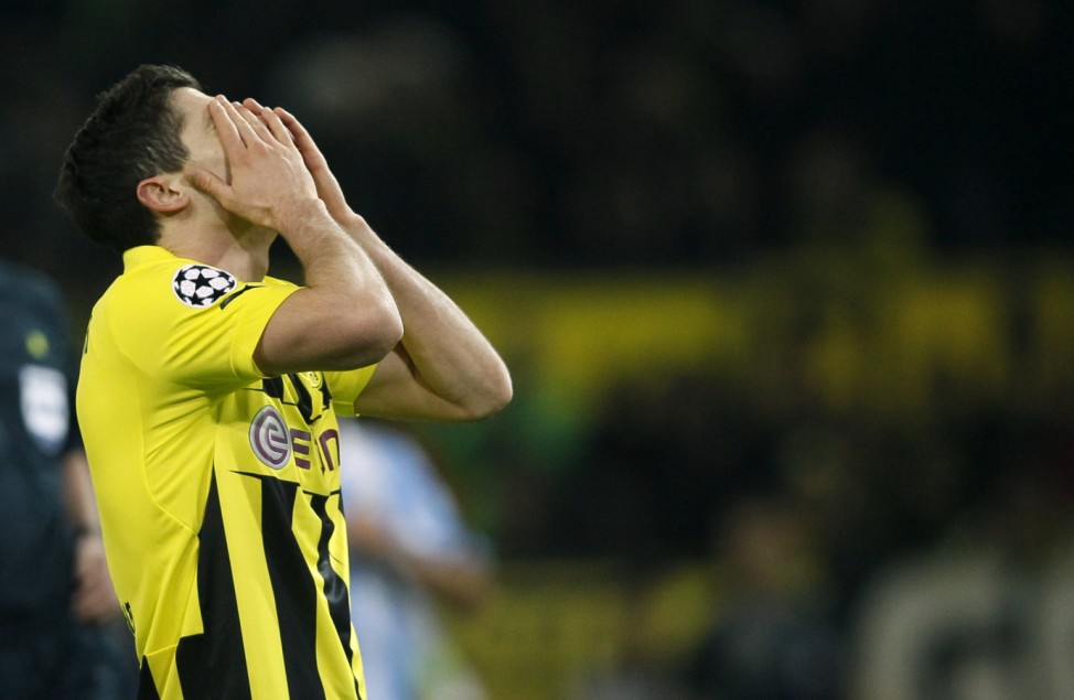 Borussia Dortmund's Lewandowski reacts after missing a chance to score against Malaga during Champions League quarter-final second leg soccer match in Dortmund