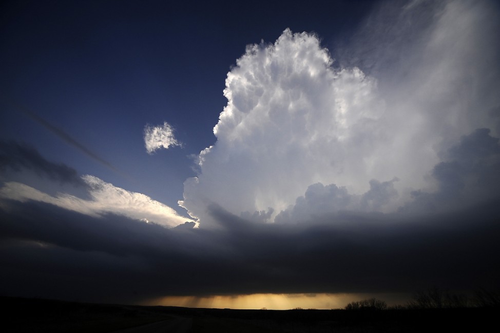 A supercell storm west of New Castle, Texas tries to build up strength