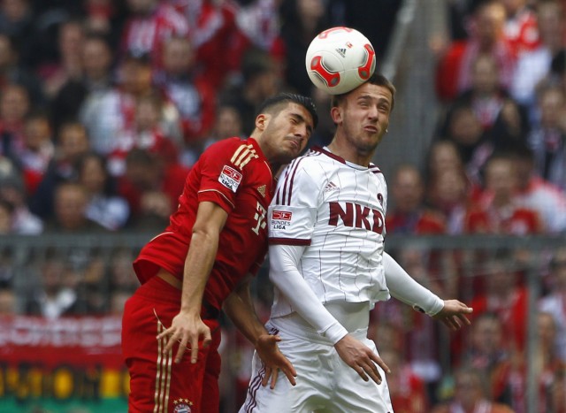 Bayern Munich's Can and Nuremberg's Pekhart head the ball during their German first division Bundesliga soccer match in Munich