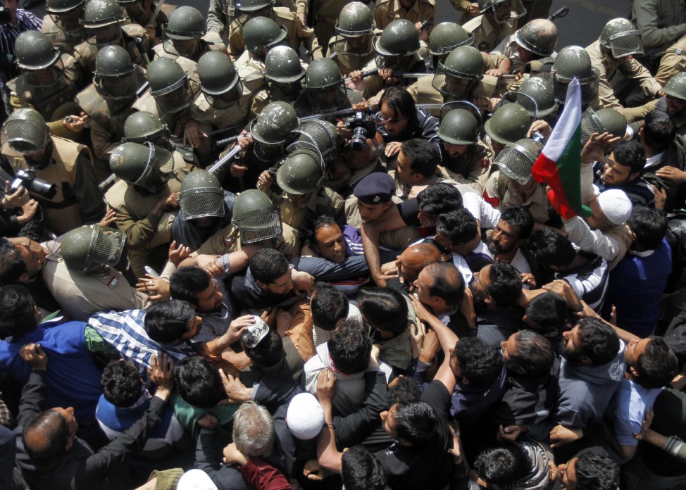 Activists from the Jammu Kashmir Liberation Front, a Kashmiri separatist party, scuffle with Indian police during a protest in Srinagar