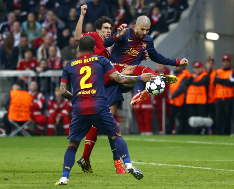 Barcelona's Pique challenges Bayern Munich's Martinez during Champions League semi-final first leg soccer match in Munich