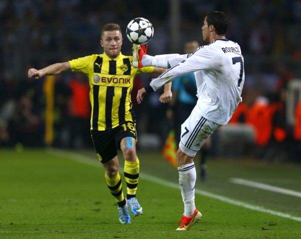 Real Madrid's Ronaldo controls ball in front of Borussia Dortmund's Blaszczykowski  in Champions League semi-final first leg soccer match in Dortmund