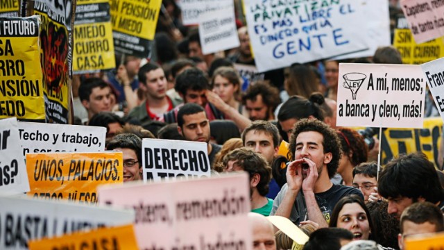 A protester shouts slogans during a demonstration in Madrid
