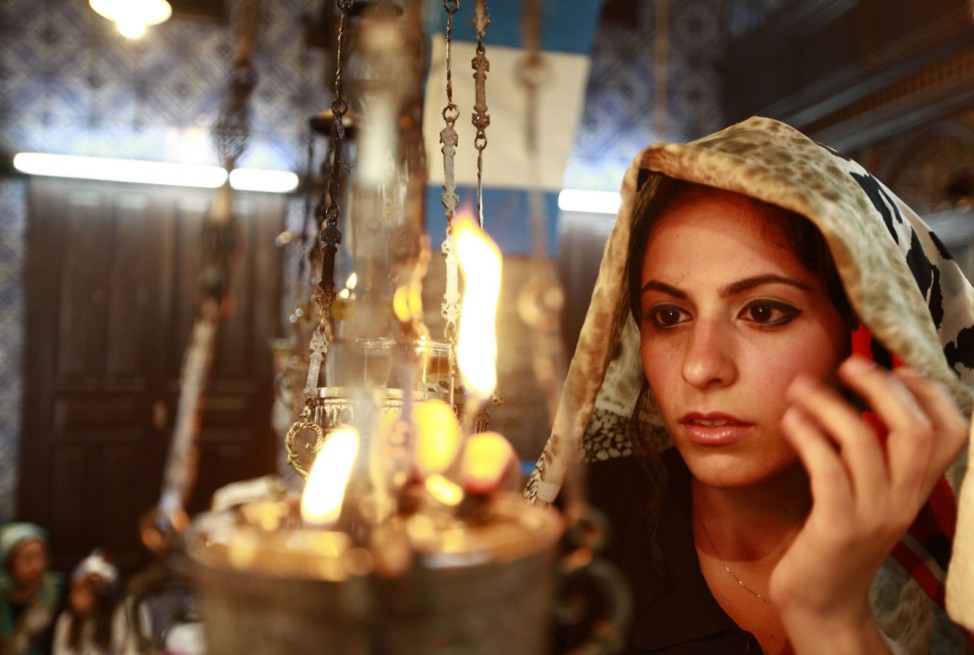 A Jewish worshipper prays during a pilgrimage to the El Ghriba synagogue in Djerba