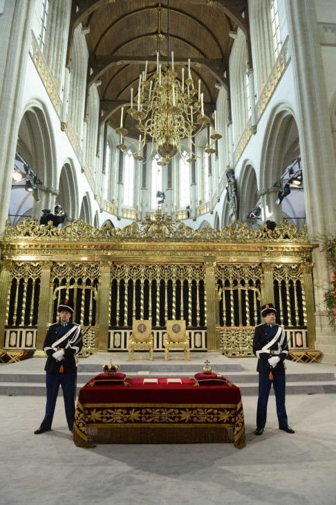 Guards stand on place where Dutch King Willem-Alexander and his wife Queen Maxima will attend a religious ceremony at the Nieuwe Kerk church in Amsterdam