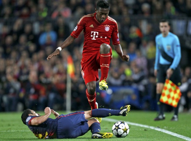 Bayern Munich's Alaba jumps over Barcelona's Hernandez during their Champions League semi-final second leg soccer match in Barcelona