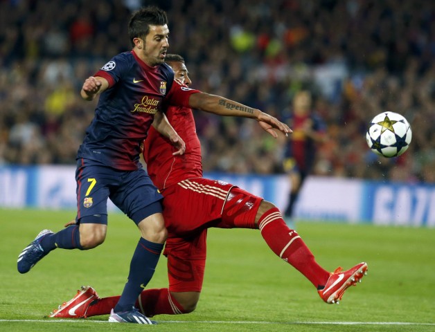 Barcelona's Villa challenges Bayern Munich's Boateng during their Champions League semi-final second leg soccer match in Barcelona