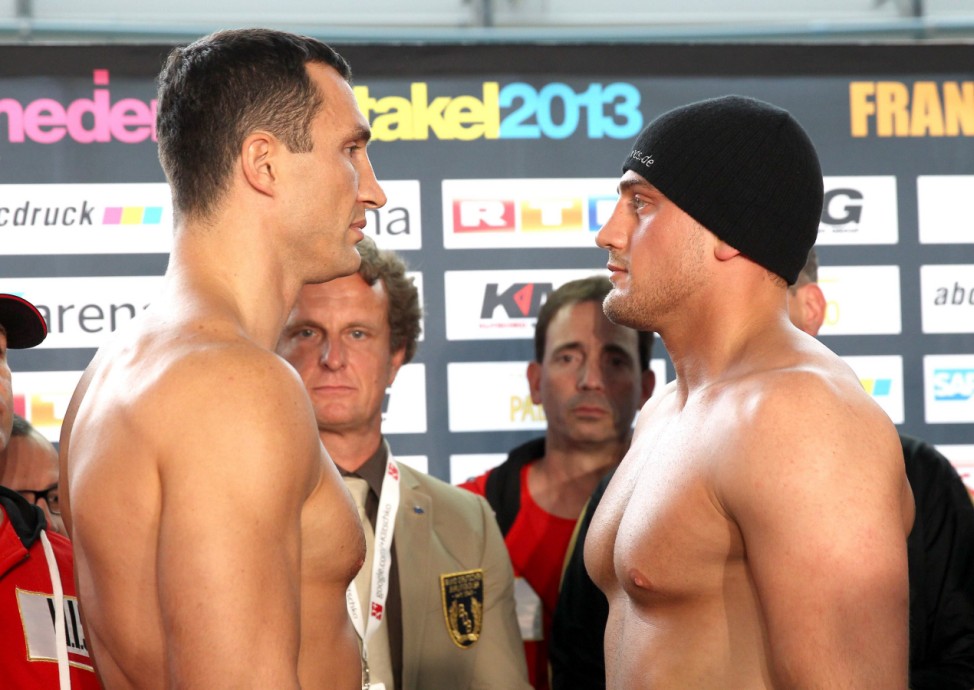 Ukrainian heavyweight boxing world champion Klitschko and Italian-born boxer Pianeta are pictured during the stare down at the official weigh in in Heidelberg