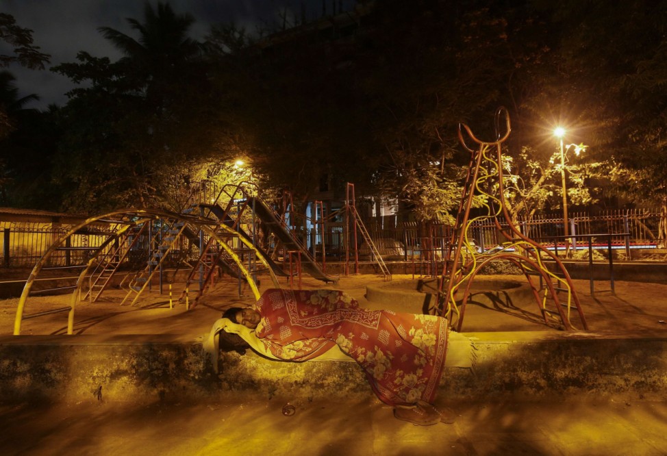Ram Pratap Verma, a 32-year-old aspiring Bollywood film actor, sleeps in a park in a residential colony in Mumbai