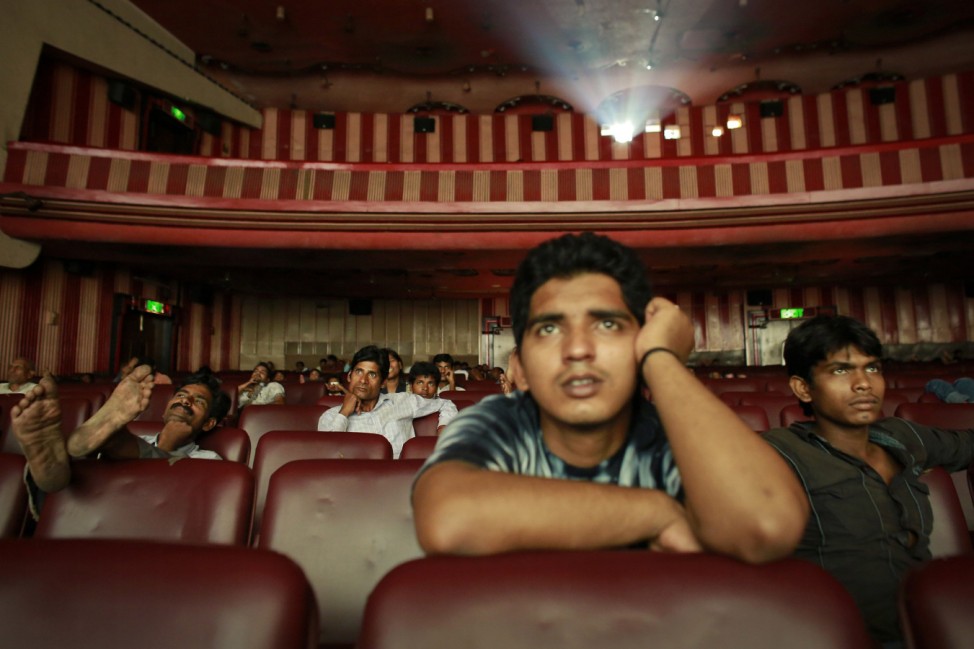 Ram Pratap Verma, a 32-year-old aspiring Bollywood film actor, watches a film at a cinema in Mumbai