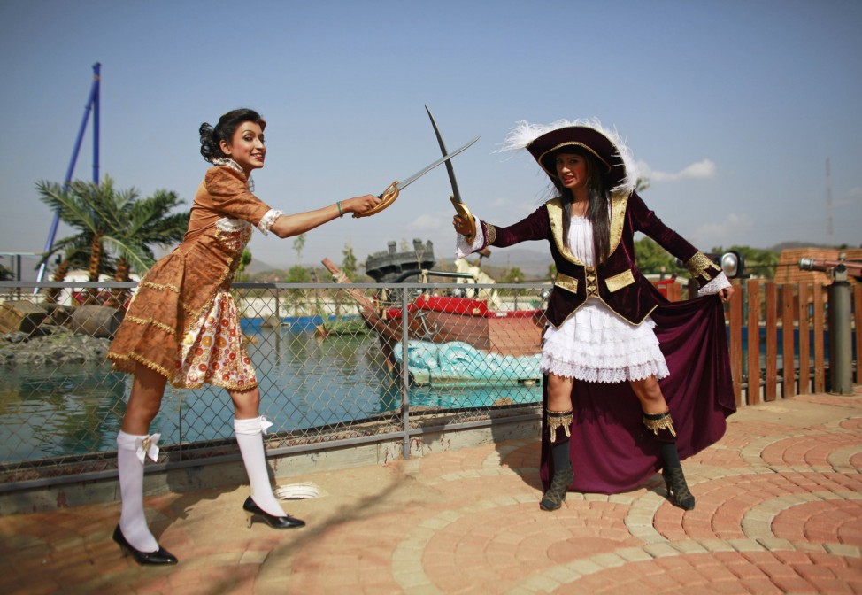 Employees dressed as pirates pose at the 'Adlabs Imagica' theme park in Khopoli