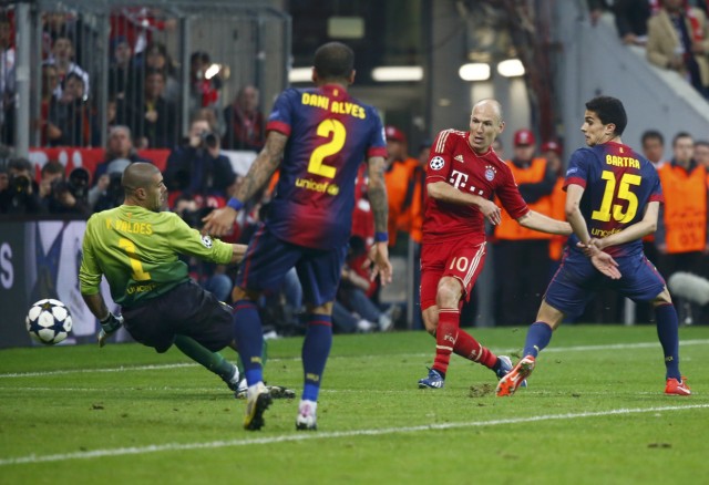 Bayern Munich's Arjen Robben scores past Barcelona's goalkeeper Victor Valdes during their Champions League semi-final first leg soccer match in Munich