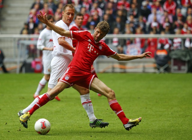 Bayern Munich's Mueller controls the ball during their German first division Bundesliga soccer match against Augsburg in Munich