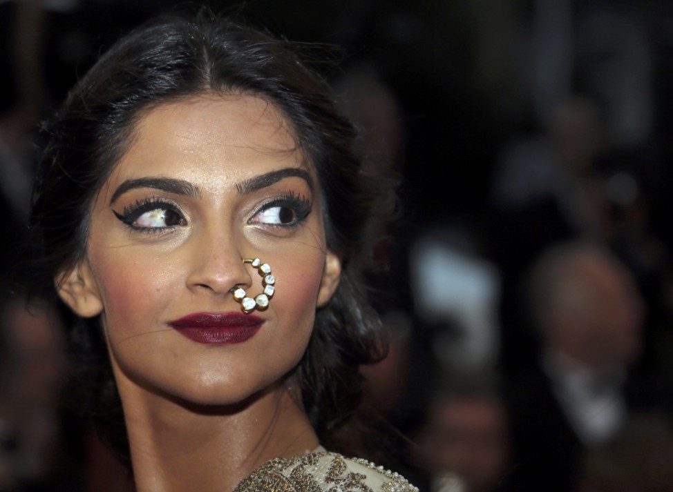 Bollywood actress Sonam Kapoor poses on the red carpet as she arrives for the screening of the film 'The Great Gatsby' and for the opening ceremony of the 66th Cannes Film Festival in Cannes