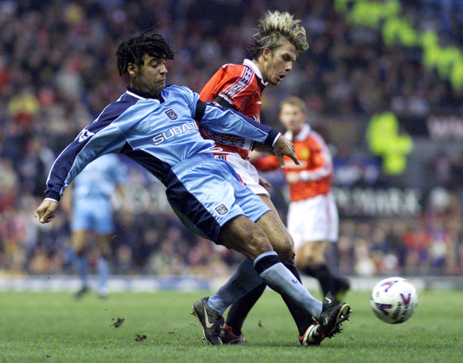 MANCHESTER'S BECKHAM TACKLED BY COVENTRY'S SHAW
