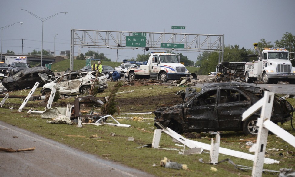Destroyed cars are seen along Interstate 35 after a tornado struck Moore, Oklahoma