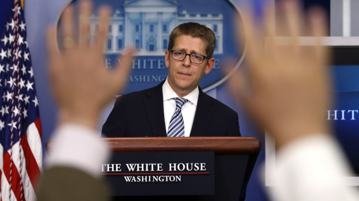 White House press secretary Carney is questioned by the press during the daily briefing at the White House in Washington