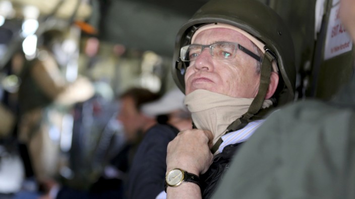 German Defence Minister Thomas de Maiziere sits in a German army Bundeswehr CH53 helicopter en route from Kunduz to Mazar-i-Sharif