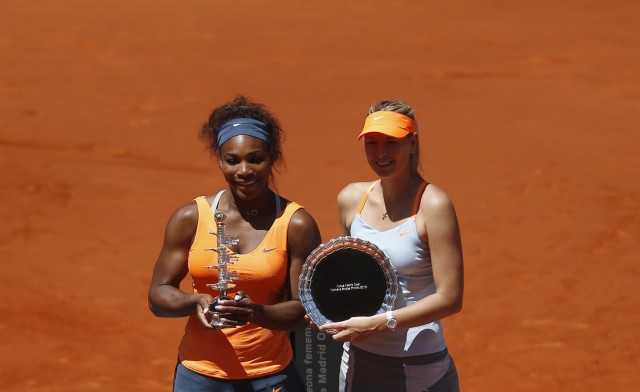 Williams of the U.S. and Sharapova of Russia pose with their first and second place trophies after their Madrid Open final tennis match in Madrid