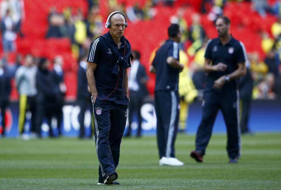 Bayern Munich's Robben walks on the pitch before for the start of the Champions League Final soccer match against Borussia Dortmund at Wembley Stadium in London