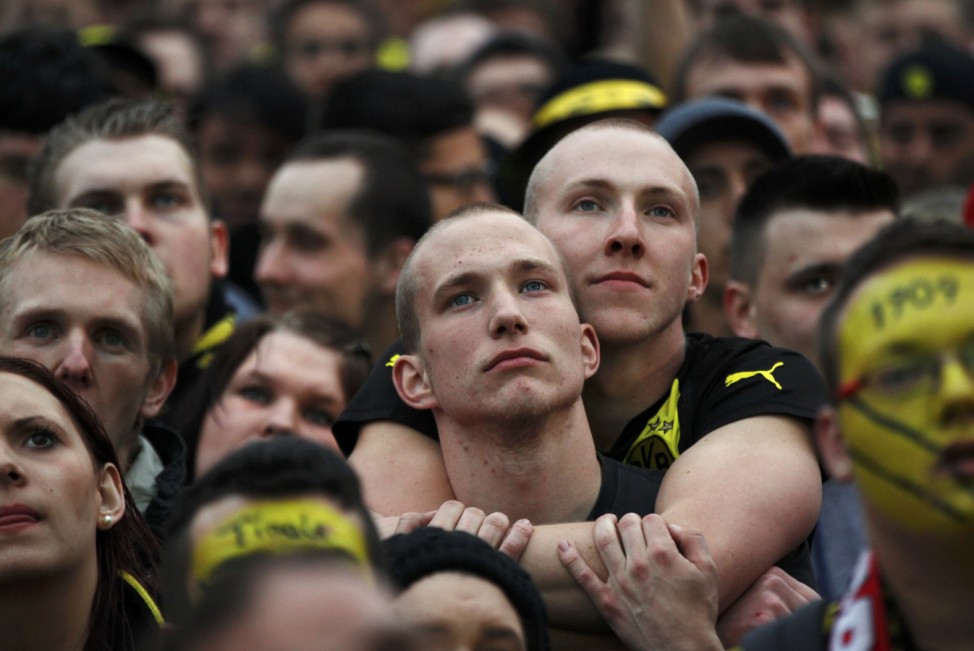 Borussia Dortmund fans react during a public viewing in downtown Dortmund of the Champions League soccer final between Bayern Munich and Borussia Dortmund at Wembley in London