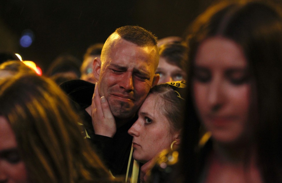 Borussia Dortmund soccer fans react at a public viewing event in Dortmund