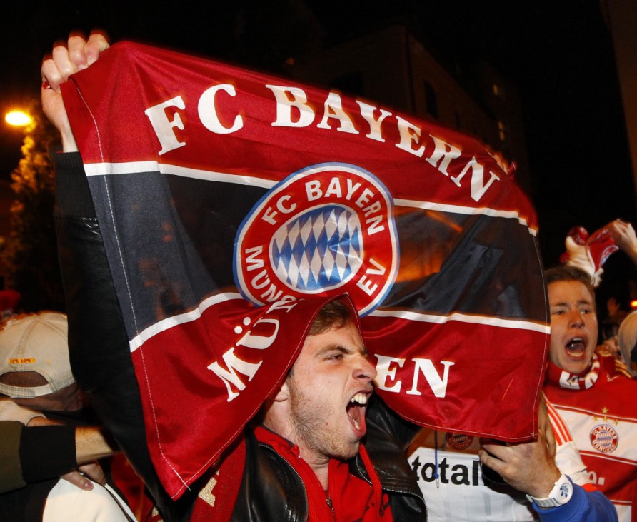 Supporters of Bayern Munich react after a public viewing event in Munich
