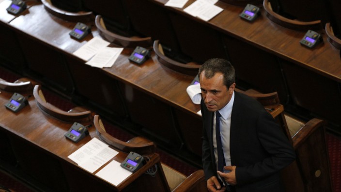 Bulgarian newly-elected Prime Minister Oresharski walks at the end of a session in the parliament in Sofia
