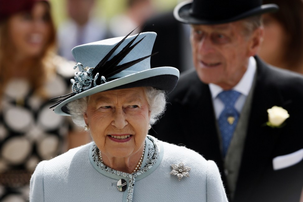 Britain's Queen Elizabeth is greeted on arrival at the Epsom Derby festival in Epsom, southwest of London