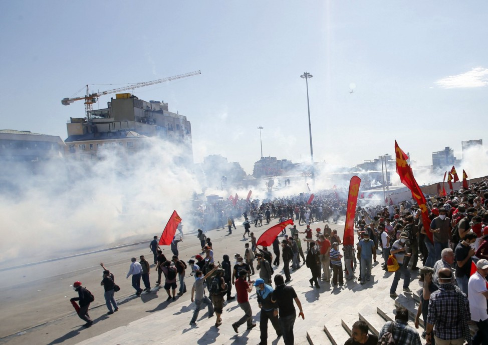 Riot police use tear gas to disperse the crowd during an anti-government protest at Taksim Square in central Istanbul